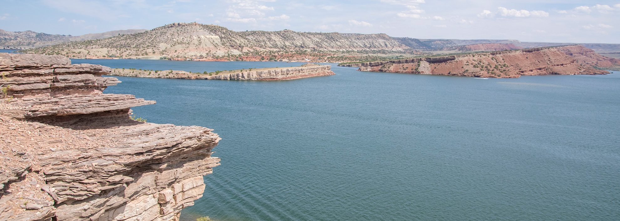 Alcova reservoir; body of water surrounded by dry cliffs